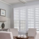 light dinning room with white plantation shutters