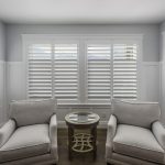 sitting room with white plantation shutters