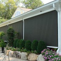 automatic patio shades on luxury home